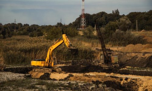 closeup-shot-ongoing-construction-with-tracks-bulldozer-abandoned-land