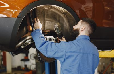 mechanic-with-tool-wheel-hands-mechanic-blue-work-clothes (1)